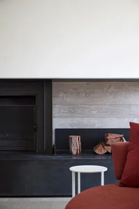 A modern living room featuring concrete + wood elements