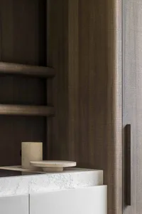 Modern bathroom featuring a textured concrete rug on the floor and a minimalist design.