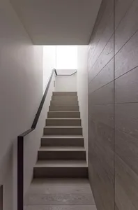 Modern staircase with wooden steps and metal railings