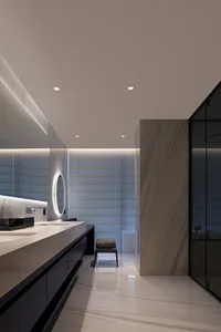 Contemporary bathroom interior with glass walls, marble surfaces, and minimalist design.