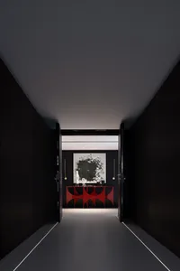 Modern entrance hall featuring glass and metal elements.
