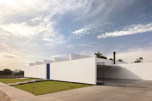 Modern architectural design with minimalist aesthetic, featuring concrete construction.