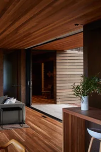 Interior design featuring dark wood floors and walls with a modern aesthetic