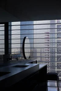 A modern interior with a glass window and minimalist design.