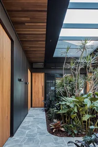 Modern lobby interior with large glass windows and metallic elements