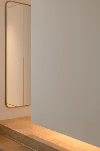 Modern minimalist interior space featuring glass materials and clean lines.