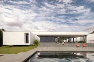 Modern residential architecture with concrete exterior and a swimming pool.