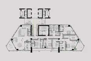 Floor plan of a modern residential building, showing multiple rooms and open spaces.