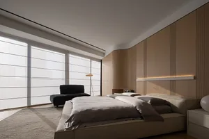 A minimalist bedroom featuring neutral-toned wood and fabric materials.