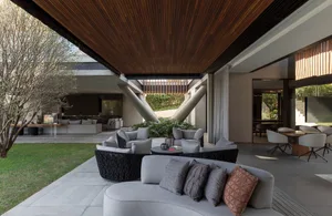 Modern minimalist living room with concrete and steel elements