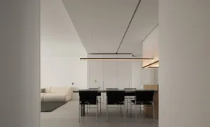 Modern minimalist living room with clean lines, white walls, and contemporary furniture.