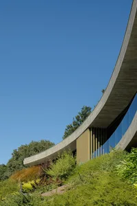 Modern building exterior with concrete and glass materials.