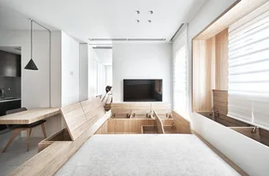 Modern apartment living room featuring wooden furniture and white decor