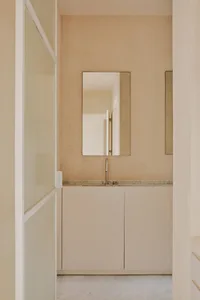 Modern bathroom with concrete walls and a taupe color scheme