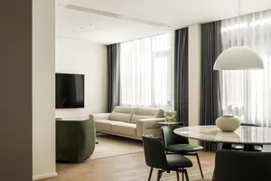 A modern living room featuring concrete and marble materials.