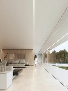 A modern minimalist living room with marble finishes and large windows.