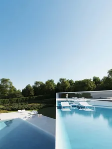 Contemporary residential area featuring glass walls and open design.