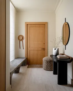 A modern entrance hall with wooden details and a bench.