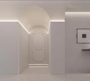 A minimalist interior design with white terrazzo flooring and a sleek, modern archway.