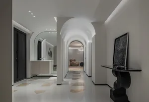 Modern entrance hall with stucco walls and marble flooring