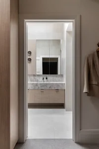 Modern bathroom with a marble countertop and minimalist design.
