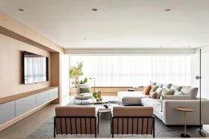A modern living room featuring a contemporary sofa, minimalistic coffee table, and industrial-style furniture.