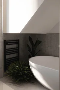 Minimalist bathroom with gray tiles, green fern plant, and black metal accent wall