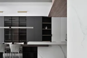 Modern kitchen with gray, wooden, and marble accents.