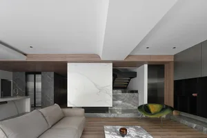 A modern living room featuring marble accents and wooden elements.