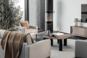Modern living room featuring wood and metal furniture and decor elements.