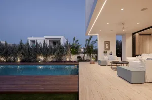 Modern residential house with swimming pool and veranda, featuring marble floor and glass walls.