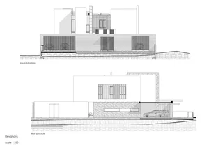 House elevation with concrete, glass, and metal materials.