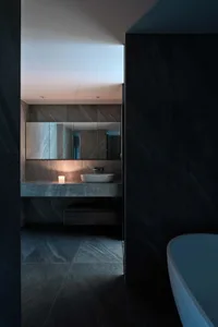 A modern stone bathroom with a sleek, futuristic design