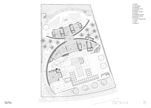 A site plan of a modern residential property with multiple rooms, a driveway, and a garden area.