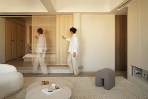 A modern living space featuring neutral-toned decor and furniture.