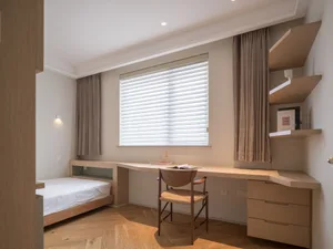 A minimalist bedroom featuring modern furniture made of wood, with a bed, desk, and shelves.