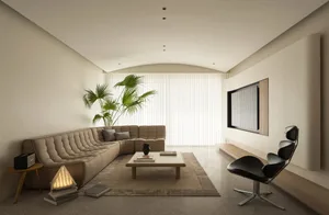 A modern minimalist living room with a comfortable sofa, a sleek coffee table, and large windows.
