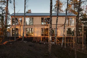 Modern residential exterior with wooden materials.