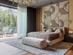 A contemporary bedroom with a luxurious bed, a curved side table, and a geometric wall design.