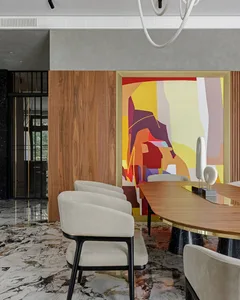 Modern dining room featuring marble, wood, and metal elements.