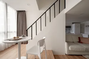 Modern living room featuring neutral colors and minimalist design.