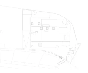 A detailed 2D architectural drawing of a modern office layout, showcasing open-plan spaces and functional zones.