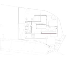 A detailed 2D architectural drawing of a residential floor plan, showcasing modern design elements and layout.