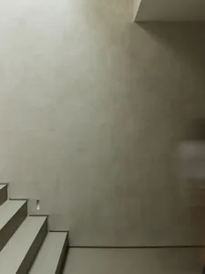 A modern interior space with concrete floors and walls.