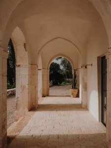 A stone archway leading to a courtyard