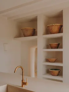 Modern minimalist kitchen with ceramic bowls and wooden accents