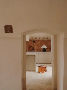 A minimalist-style interior space featuring tile and cement materials.