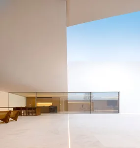 Modern interior design featuring glass and concrete materials.