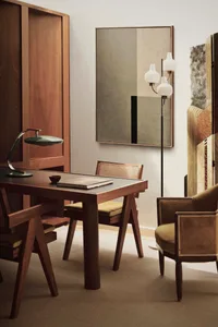 Modern interior design featuring wooden furniture and leather accents in a home office setting.