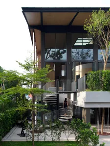 A modern residential building with a glass and concrete exterior